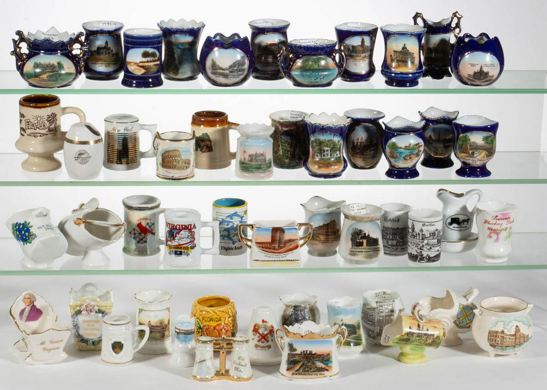 ASSORTED SOUVENIR PORCELAIN TOOTHPICK HOLDERS, LOT OF: ASSORTED SOUVENIR PORCELAIN TOOTHPICK HOLDERS, LOT OF 50, including sixteen examples having cobalt ground, a cradle-form example with George Washington decal and "Mt. Vernon / Virginia" to front, a bi