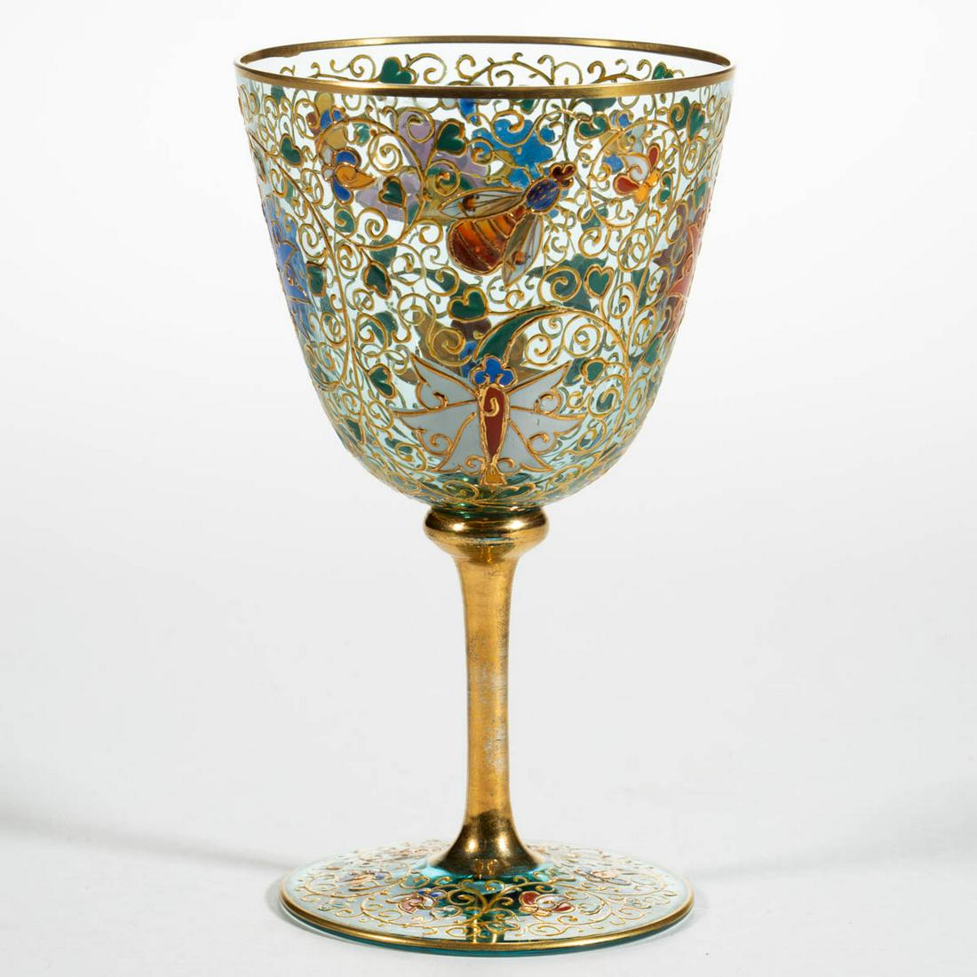 MOSER ATTRIBUTED KAKAIMON DECORATED GOBLET: MOSER ATTRIBUTED KAKAIMON DECORATED GOBLET, pale blue with polychrome-enamel decoration, having stylized butterflies, bees, and floral decoration. Bohemia, now Czech Republic. Circa 1885. 5 3/4" H. Un