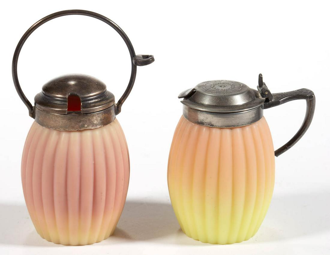 MT. WASHINGTON BURMESE RIBBED-BARREL MUSTARD POTS, LOT: MT. WASHINGTON BURMESE RIBBED-BARREL MUSTARD POTS, LOT OF TWO, plush, each having a silver-plate lid with one having an integral handle and other with a loop handle and a spoon hanger. Mt. Washington 