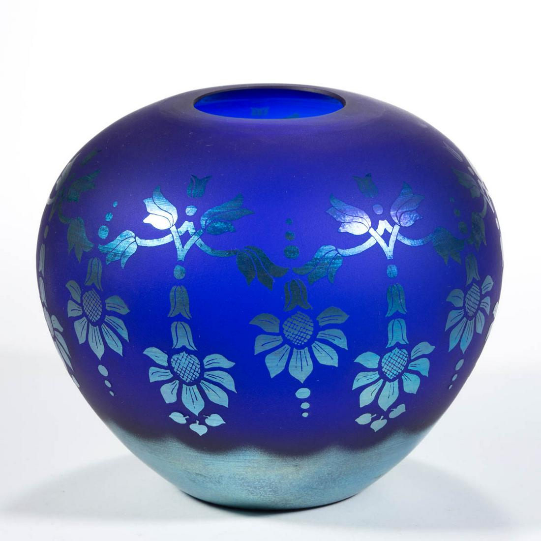 FENTON FAVRENE IRIDESCENT ART GLASS VASE: FENTON FAVRENE IRIDESCENT ART GLASS VASE, blue and blue iridescent, rose bowl form with draped floral decoration, signed to the underside and numbered "269/600". Fenton Art Glass Co. Fourth quarter 20