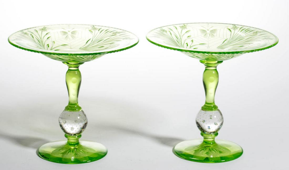 PAIRPOINT COLIAS CUT GLASS PAIR OF TAZZAS / COMPOTES: PAIRPOINT COLIAS CUT GLASS PAIR OF TAZZAS / COMPOTES, green, each with a wide bowl and spherical air-trap connector, eight-petal flower to the underside of the base. Pairpoint Corporation. Circa 1925.
