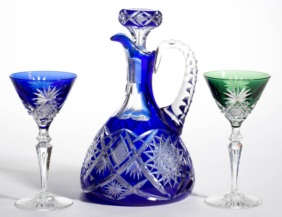 VAL ST. LAMBERT ATTRIBUTED CUT-OVERLAY DRINKING: VAL ST. LAMBERT ATTRIBUTED CUT-OVERLAY DRINKING ARTICLES, LOT OF THREE, comprising a blue to colorless ewer with matching stopper and diamond and chevron motif, and a green to colorless and a blue to 