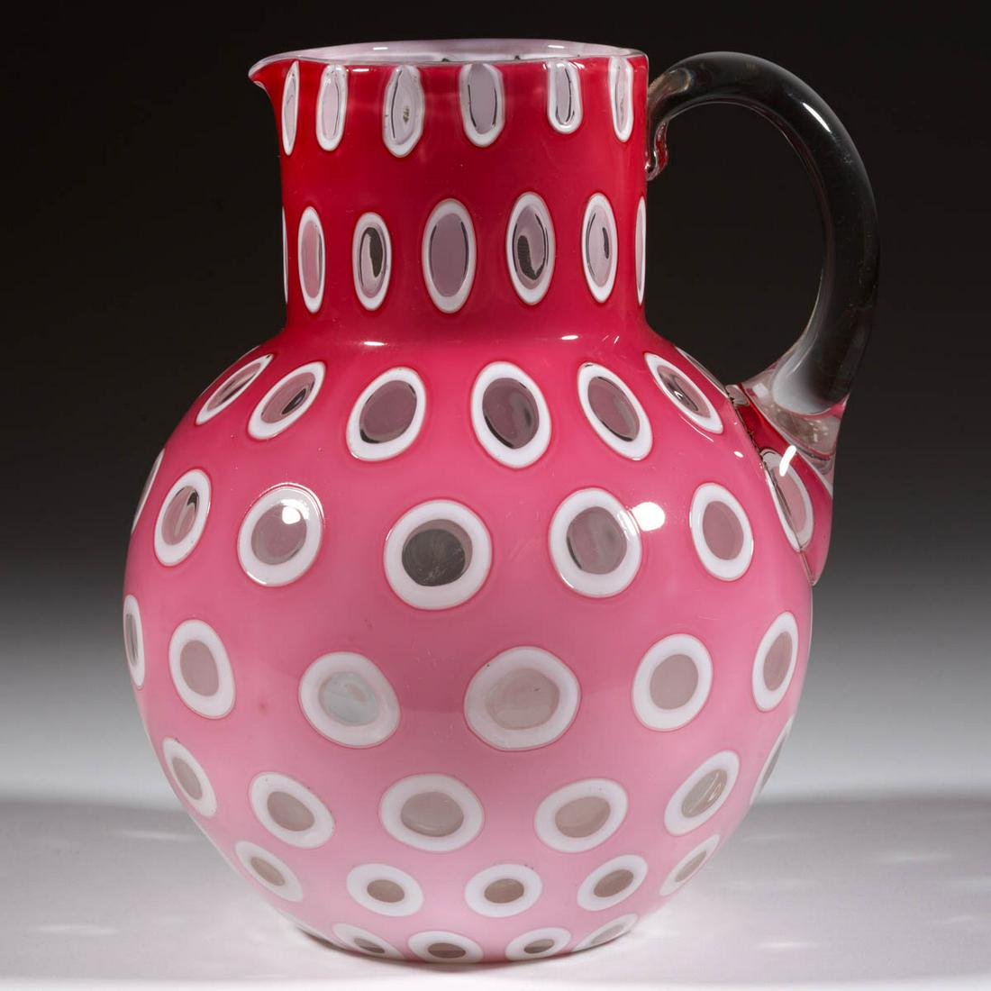 OVERLAY WINDOWS GLASS PITCHER: OVERLAY WINDOWS GLASS PITCHER, shaded cranberry to opaque white to colorless, globular-form with a cylindrical neck, applied colorless handle, polished pontil mark. Harrach, Bohemia, now Czech Republi