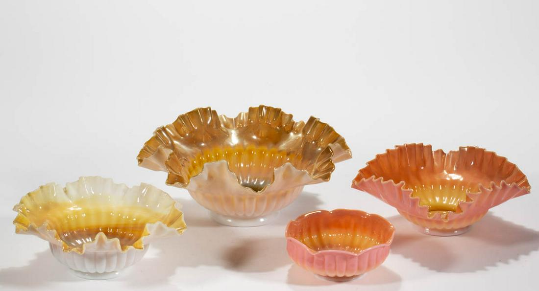 ASSORTED IRIDESCENT GLASS BOWLS, LOT OF FOUR: ASSORTED IRIDESCENT GLASS BOWLS, LOT OF FOUR, comprising two amber/agate and two Burmese examples. Various makers. Late 19th/early 20th century. 2" to 4 1/4" H, 4 7/8" to 10" DOA. Undamaged with each 