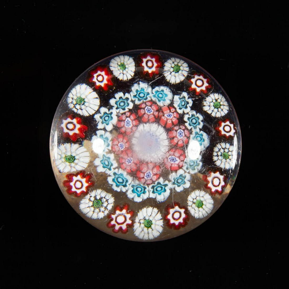 ANTIQUE BACCARAT CONCENTRIC MILLEFIORI PAPERWEIGHT: ANTIQUE BACCARAT CONCENTRIC MILLEFIORI PAPERWEIGHT, colorless, four rings of millefiori canes with the outer band having stardust canes with green centers, many canes having a star motif. France. 19th
