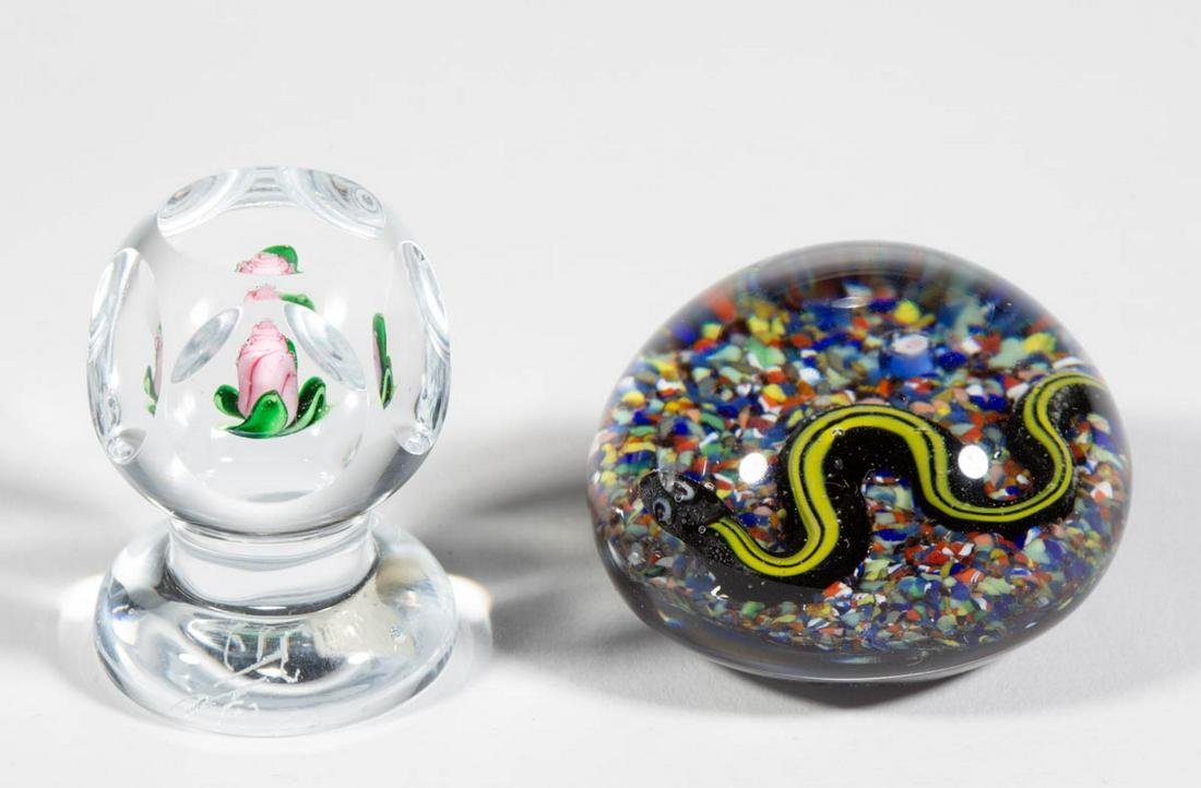 BANFORD LAMPWORK STUDIO ART GLASS PAPERWEIGHTS, LOT OF: BANFORD LAMPWORK STUDIO ART GLASS PAPERWEIGHTS, LOT OF TWO, colorless, comprising a Bob Banford black and yellow snake above a polychrome frit ground, and a Ray Banford floral pedestal cut-faceted exa
