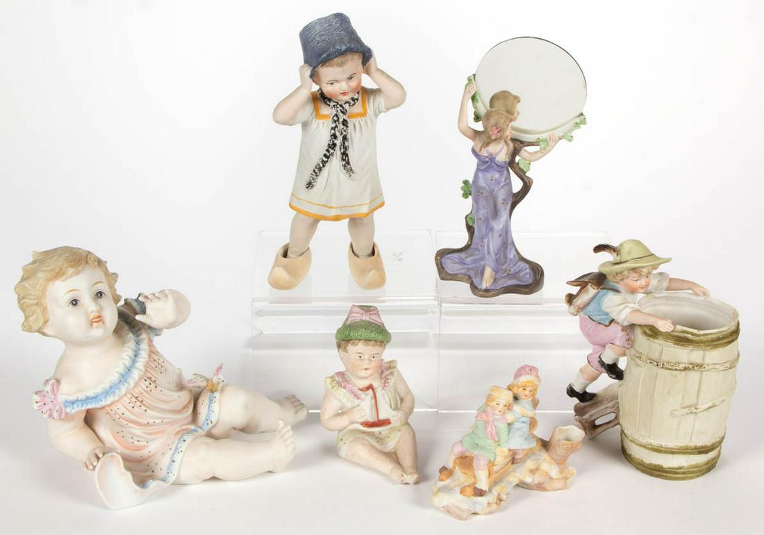 GERMAN HAND-PAINTED BISQUE PORCELAIN FIGURES, LOT OF: GERMAN HAND-PAINTED BISQUE PORCELAIN FIGURES, LOT OF SIX, including a woman wearing a flowing purple dress holding a circular mirror, a barrel-shaped spill vase with child wearing lederhosen and hat g