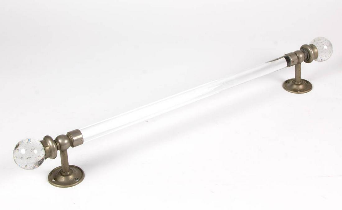 VINTAGE BUBBLE-BALL TOWEL RACK: VINTAGE BUBBLE-BALL TOWEL RACK, Lucite bar fitted into two nickeled metal mounts marked "S. STERNAU & CO. BROADWAY", each with having a controlled-bubble glass ball at the end. Circa 1920. 3 1/2" D, 2