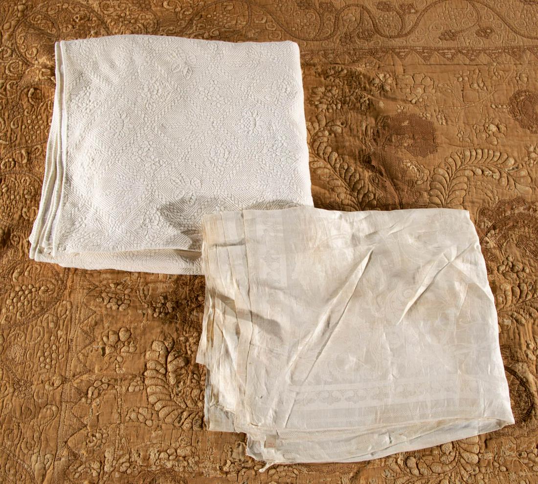 ASSORTED ANTIQUE TEXTILES, LOT OF THREE: ASSORTED ANTIQUE TEXTILES, LOT OF THREE, comprising a white table cover with a central spread-wing American eagle encompassed by Arabesque-style border along four sides and Neoclassical cameos to the 