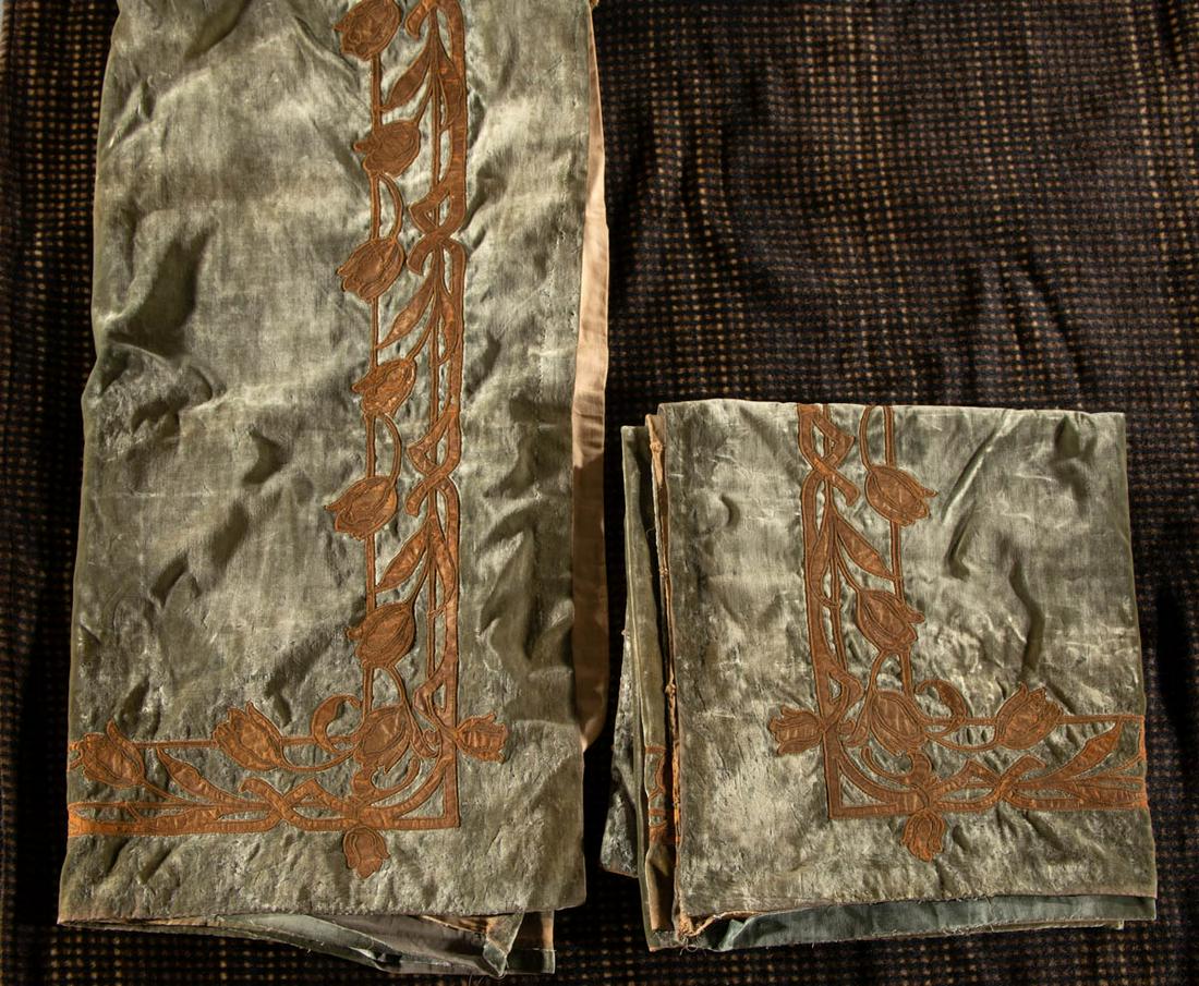 ASSORTED ANTIQUE / VINTAGE FABRIC ARTICLES, LOT OF: ASSORTED ANTIQUE / VINTAGE FABRIC ARTICLES, LOT OF THREE, comprising a pair of large green velvet drapes/curtains having applied leather border of an Art Nouveau-style tulip pattern with later applied