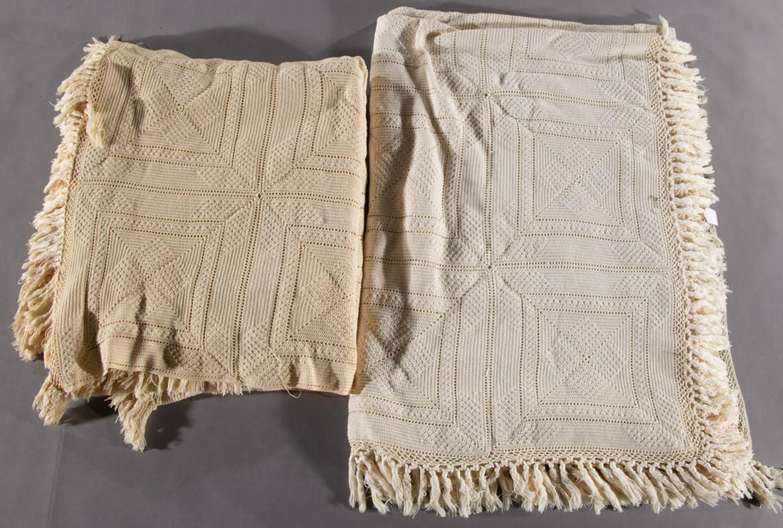 ANTIQUE / VINTAGE CROCHETED BEDSPREADS, SET OF TWO: ANTIQUE / VINTAGE CROCHETED BEDSPREADS, SET OF TWO, each with same raised geometric patterns and fringe along three edge. First half 20th century. One 100" x 90" with fringe; other 107" x 79" with fri
