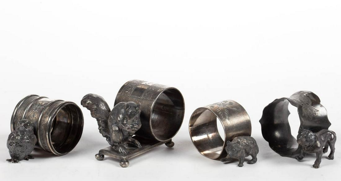 ROGERS, SMITH & CO. AND OTHER ANIMAL FIGURAL: ROGERS, SMITH & CO. AND OTHER ANIMAL FIGURAL SILVER-PLATED NAPKIN RINGS, LOT OF FOUR, comprising a number "194" example by Rogers, Smith & Co. with a squirrel, a number "266" example by Rogers & Bro.
