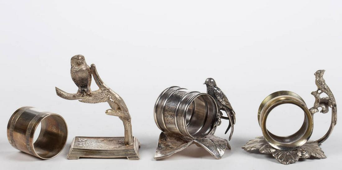 MERIDEN BRITANNIA CO. AND OTHER BIRD FIGURAL: MERIDEN BRITANNIA CO. AND OTHER BIRD FIGURAL SILVER-PLATED NAPKIN RINGS, LOT OF THREE, comprising a number "202" example by Meriden Britannia Co. with a bird perched on the stem of the leaf base, a nu