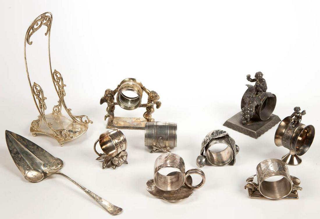 FIGURAL SILVER-PLATED NAPKIN RINGS AND OTHER ARTICLES,: FIGURAL SILVER-PLATED NAPKIN RINGS AND OTHER ARTICLES, LOT OF TEN, comprising eight napkin rings including a number "74" bird example and a number "96" lily pad by Middletown Plate Co., a number "0153
