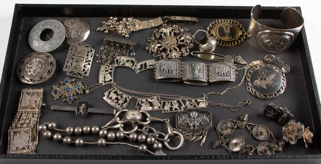 INTERNATIONAL STERLING SILVER AND OTHER JEWELRY, LOT OF: INTERNATIONAL STERLING SILVER AND OTHER JEWELRY, LOT OF 27 PIECES, including a French 0.800 silver bracelet wristwatch with winding mechanism, an Egyptian silver filigree and chain bracelet, a reticul