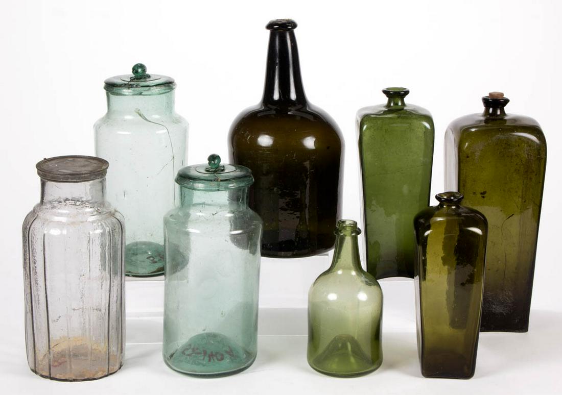 ASSORTED BLOWN GLASS UTILITY BOTTLES AND JARS, LOT OF: ASSORTED BLOWN GLASS UTILITY BOTTLES AND JARS, LOT OF EIGHT, comprising three black glass/olive green case bottles, two black glass/olive green mallet-form bottles, and three aquamarine storage jars,