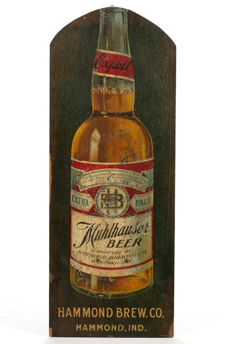 HAMMOND BREW CO., HAMMOND, INDIANA, MULHAUSER BEER: HAMMOND BREW CO., HAMMOND, INDIANA, MULHAUSER BEER SALOON SIGN, decal transfer on wood veneer, depicting a full-size beer bottle, retains original manufacturer's label on the reverse. Together with a