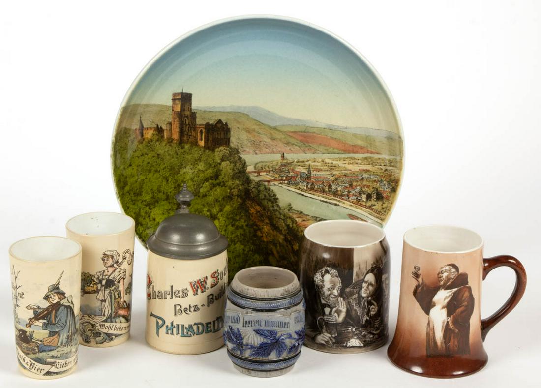 GERMAN CERAMIC ARTICLES, LOT OF SIX: GERMAN CERAMIC ARTICLES, LOT OF SIX, including two beakers, each mold number 2327, comprising a fiddler (1023) and a barmaid (1025), each featuring transfer-printed images, a barrel form 1/4 liter sal