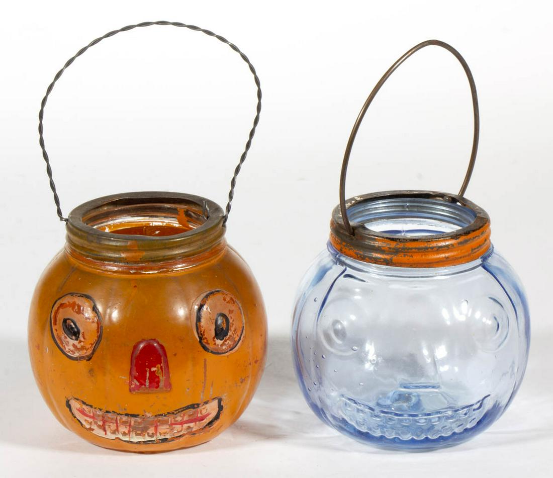 HALLOWEEN JACK O'LANTERN FIGURAL GLASS CANDY CONTAINERS: HALLOWEEN JACK O'LANTERN FIGURAL GLASS CANDY CONTAINERS / CANDLE HOLDERS, LOT OF TWO, colorless with original paint and blue, each with small interior indention in bottom and screw-on ring, replaced b