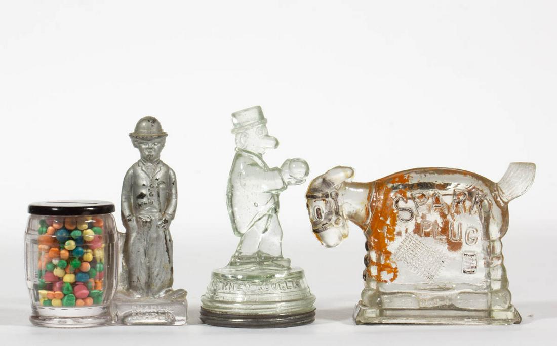 ASSORTED CHARACTER FIGURAL GLASS CANDY CONTAINERS, LOT: ASSORTED CHARACTER FIGURAL GLASS CANDY CONTAINERS, LOT OF THREE, colorless, two with partial paint, comprising "CHARLIE CHAPLIN" by Borgfeldt, "BARNEY GOOGLE" with ball, and "SPARK PLUG", each with ad
