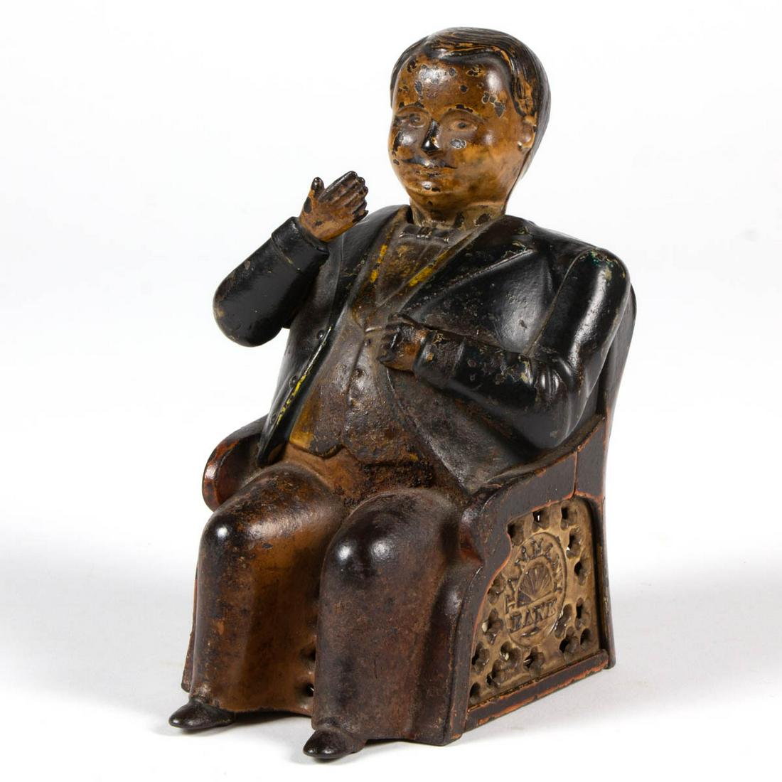 J & E STEVENS TAMMANY BANK CAST-IRON MECHANICAL BANK: J & E STEVENS TAMMANY BANK CAST-IRON MECHANICAL BANK, marked with name to each side and "PAT DEC 23 1873" to reverse, no markings to underside of base. Original paint. J & E Stevens Co., Cromwell, CT.