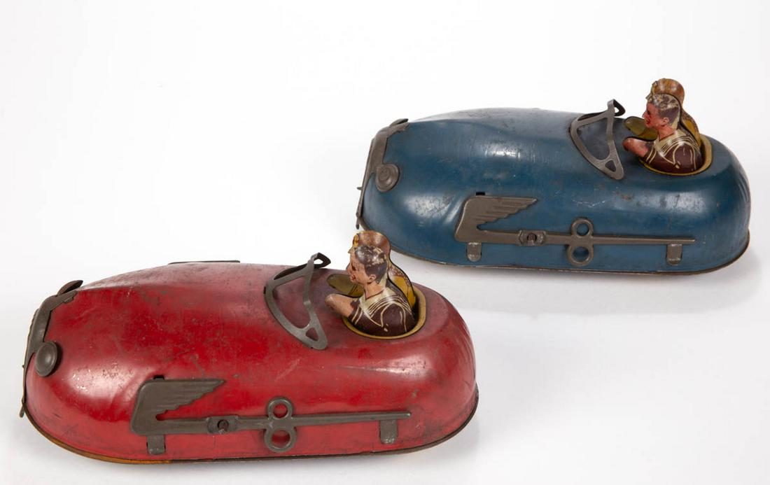 VINTAGE LINDSTROM "SKETTER BUG" WIND-UP BUMPER CAR: VINTAGE LINDSTROM "SKETTER BUG" WIND-UP BUMPER CAR TOYS, LOT OF TWO, red and blue examples, each retaining likely original lithographed riders. Circa 1930. Each 9" L. Each in good overall condition wi