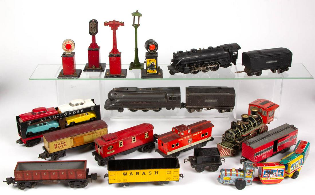 ASSORTED VINTAGE TRAIN TOYS, LOT OF 19: ASSORTED VINTAGE TRAIN TOYS, LOT OF 19, including examples by Marx and Lionel. 20th century. Lionel 1668-E locomotive 9 1/4" LOA. As-found condition, most with wear and losses.