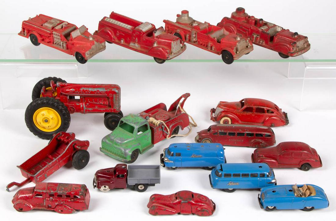 ASSORTED VINTAGE VEHICLE TOYS, LOT OF 15: ASSORTED VINTAGE VEHICLE TOYS, LOT OF 15, including fire trucks, a tractor, and a tow truck. 20th century. Tow truck 8 1/4" LOA. As-found condition, most with wear and losses.