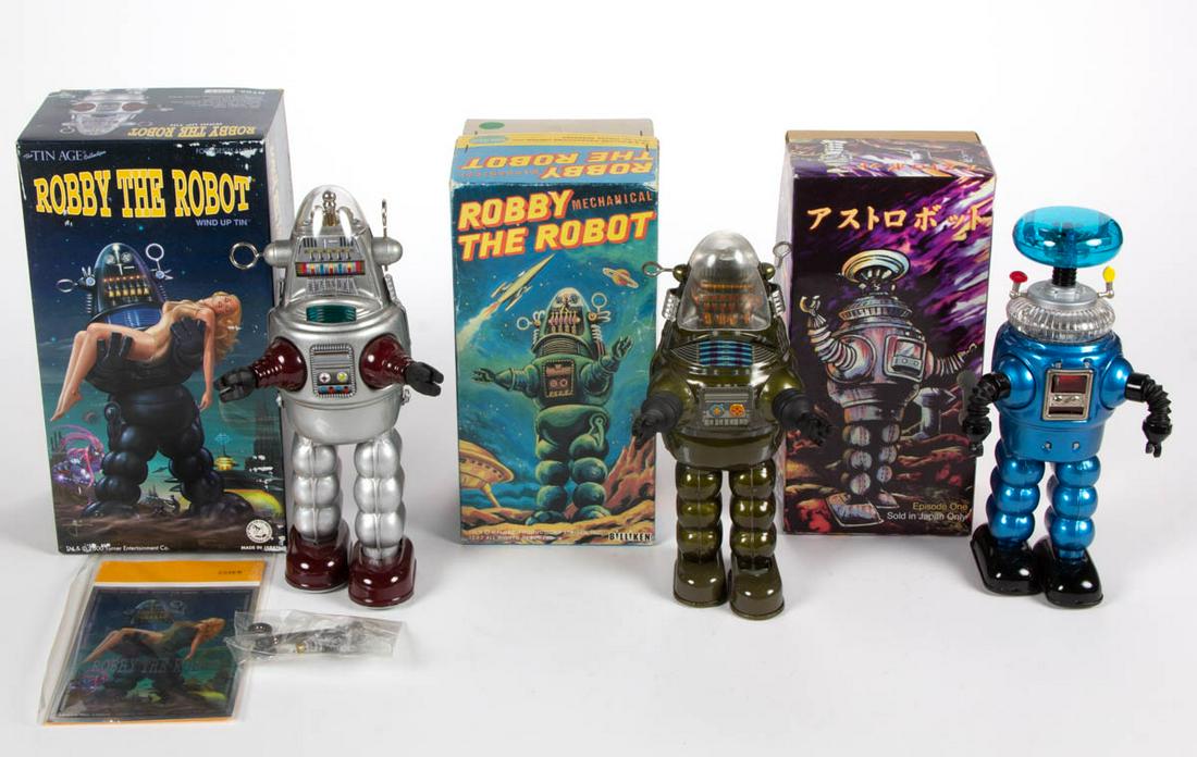 ASSORTED JAPANESE MECHANICAL ROBBY THE ROBOTS, LOT OF: ASSORTED JAPANESE MECHANICAL ROBBY THE ROBOTS, LOT OF THREE, including one from "The Tin Age Collection" by Osaka Tin Toy Institute. Circa 2000. Tin Age 10 1/2" H box.Very good overall condition, stil