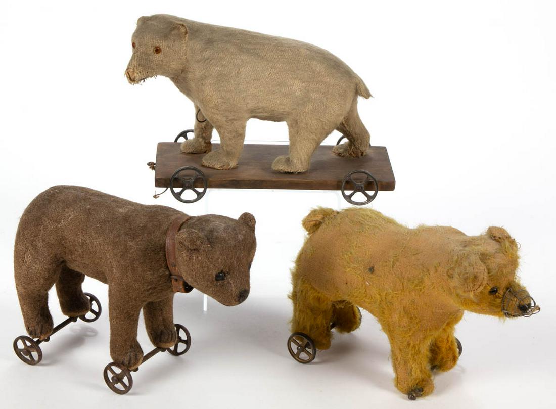 ANTIQUE FIGURAL ANIMAL PULL TOYS, LOT OF THREE: ANTIQUE FIGURAL ANIMAL PULL TOYS, LOT OF THREE, comprising one wearing a leather collar, one wearing a muzzle, and the other with growler pull. Fourth quarter 19th/first quarter 20th century. 6 1/4" t
