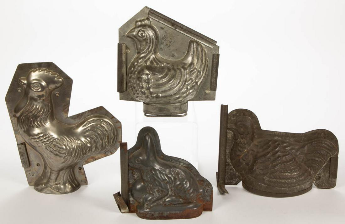 ASSORTED FIGURAL METAL CHOCOLATE / ICE CREAM MOLDS, LOT: ASSORTED FIGURAL METAL CHOCOLATE / ICE CREAM MOLDS, LOT OF FOUR, comprising rooster, rabbit with egg, and two hens on nest examples. First half 20th century. 7" to 10 3/4" H. Good to very good overall