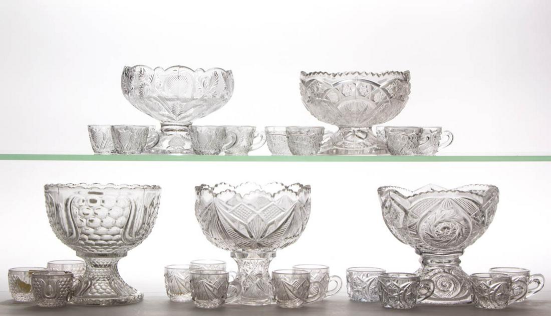ASSORTED PRESSED CHILDREN'S GLASS PUNCH SETS, LOT OF: ASSORTED PRESSED CHILDREN'S GLASS PUNCH SETS, LOT OF FIVE, colorless, including a four-piece Tulip and Honeycomb, a seven-piece Sheaf of Wheat, a five-piece Buzz Star, a six-piece Rex, and a seven-pie