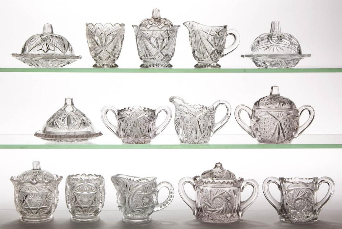 ASSORTED PRESSED CHILDREN'S GLASS TOY TABLE ARTICLES,: ASSORTED PRESSED CHILDREN'S GLASS TOY TABLE ARTICLES, LOT OF 14, colorless, including a Rex four-piece table set, and a Cambridge Sweetheart four-piece table set. Various makers. Late 19th/first quart