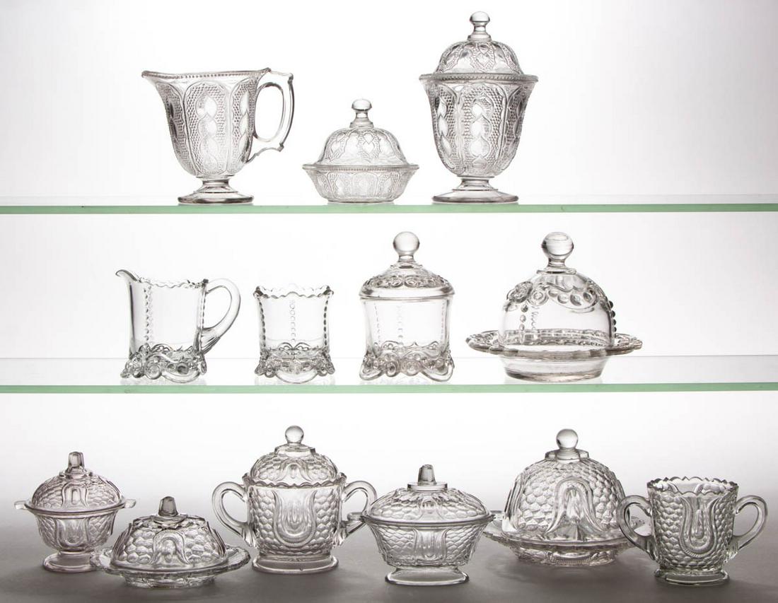 ASSORTED PRESSED CHILDREN'S GLASS TOY TABLE ARTICLES,: ASSORTED PRESSED CHILDREN'S GLASS TOY TABLE ARTICLES, LOT OF 13, colorless, comprising six Tulip and Honeycomb articles including a four-piece table set, a Bead and Scroll four-piece table set, and a 