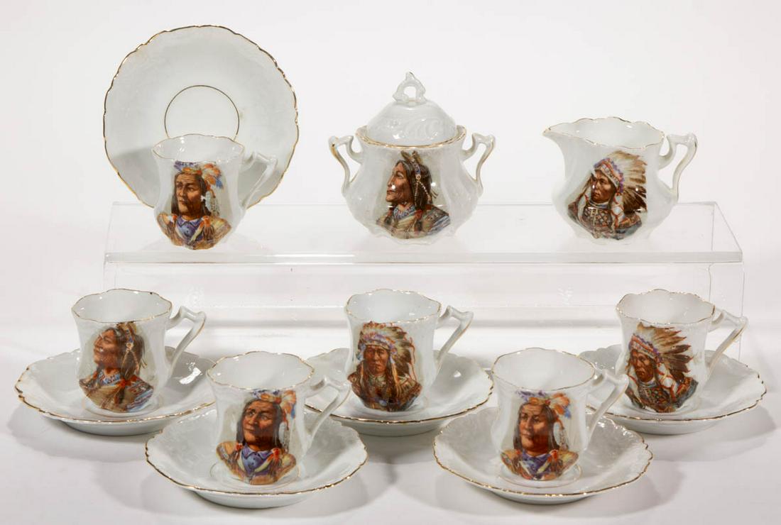 GERMAN NATIVE AMERICAN PORCELAIN PARTIAL CHILD'S TEA: GERMAN NATIVE AMERICAN PORCELAIN PARTIAL CHILD'S TEA SET, LOT OF 14, comprising a covered sugar, a creamer, and six cup and saucer sets, featuring bright polychrome decals of Native American chiefs wi