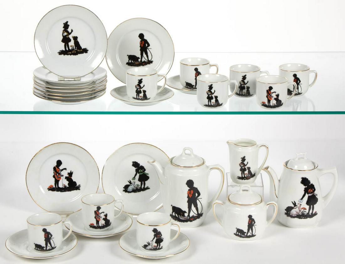 GERMAN PORCELAIN SILHOUETTES MOTIF 28-PIECE CHILD'S TEA: GERMAN PORCELAIN SILHOUETTES MOTIF 28-PIECE CHILD'S TEA SET, comprising a teapot with cover together by association, a coffee pot, a covered sugar, a creamer, nine cups, five saucers, and ten 5" D pla