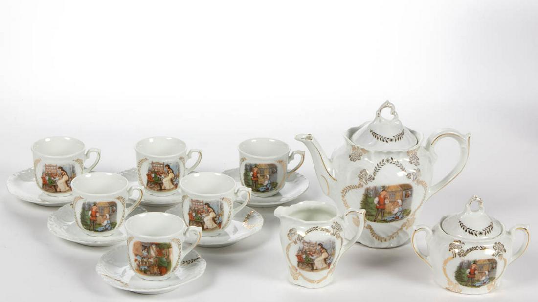 GERMAN PORCELAIN FAIRY TALE MOTIF 15-PIECE CHILD'S TEA: GERMAN PORCELAIN FAIRY TALE MOTIF 15-PIECE CHILD'S TEA SET, comprising a teapot, a creamer, a covered sugar, and six cup and saucer sets, having polychrome decals featuring Snow White and the Seven Dw