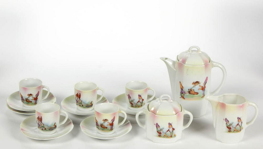 GERMAN PORCELAIN GNOMES MOTIF 14-PIECE CHILD'S TEA SET: GERMAN PORCELAIN GNOMES MOTIF 14-PIECE CHILD'S TEA SET, comprising a teapot, a creamer, a covered sugar, five cups, and six saucers, each having bright polychrome decals featuring small bearded men ho