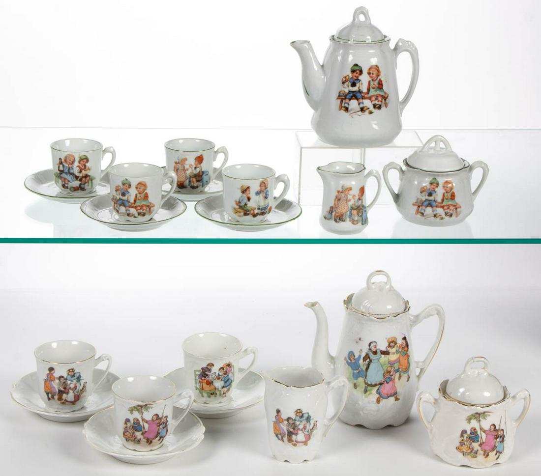 GERMAN PORCELAIN CHILD'S TEA SETS, LOT OF TWO: GERMAN PORCELAIN CHILD'S TEA SETS, LOT OF TWO, comprising an 11-piece set including a teapot, a sugar with ill-fitting cover together by association, a creamer, and four cup and saucer sets, each havi