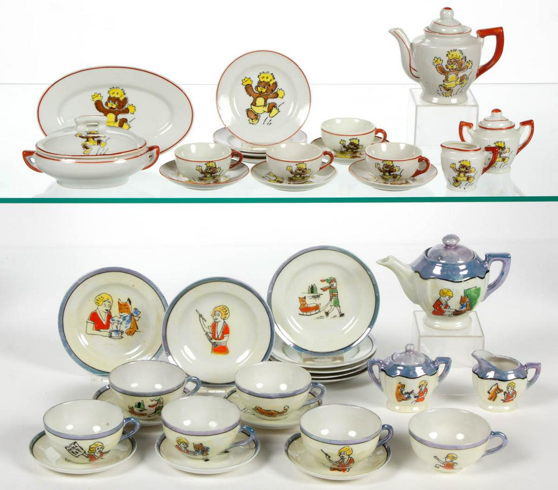JAPANESE PORCELAIN LITTLE ORPHAN ANNIE 21-PIECE CHILD: JAPANESE PORCELAIN LITTLE ORPHAN ANNIE 21-PIECE CHILD'S TEA SET, comprising a teapot, a creamer, a covered sugar, six cups, five saucers, and seven 4 3/8" D plates, each having black transfer with pol