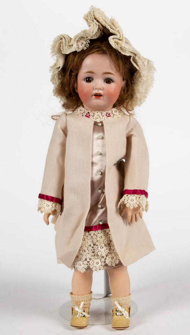 GERMAN J. D. KESTNER BISQUE-HEAD CHARACTER GIRL DOLL: GERMAN J. D. KESTNER BISQUE-HEAD CHARACTER GIRL DOLL, socket head, back with impressed "J. D. K. / 260 / Made in Germany / 34", sleepy-brown eyes with applied eyelashes, painted facial features includ
