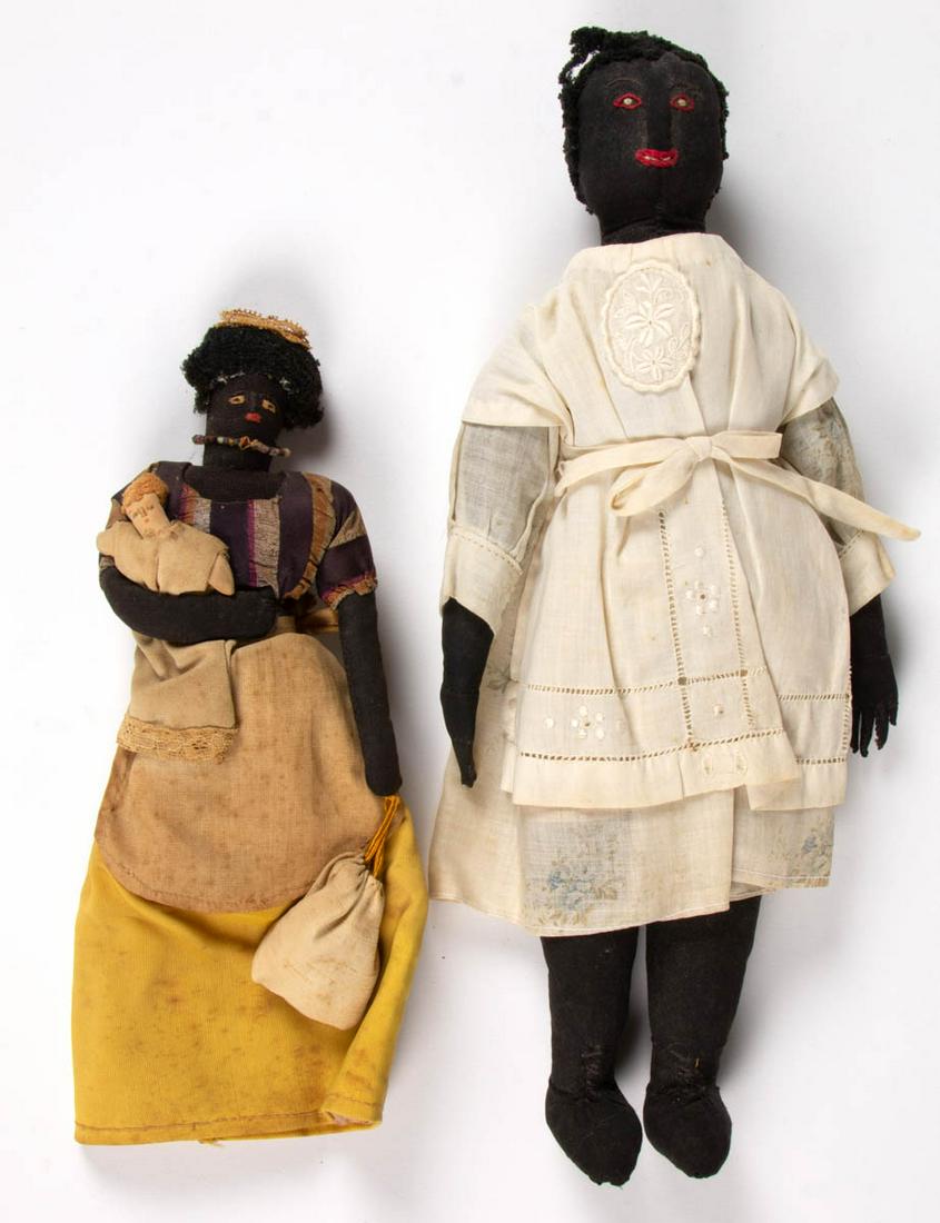 BLACK AMERICANA CLOTH DOLLS / RAG DOLLS, LOT OF TWO: BLACK AMERICANA CLOTH DOLLS / RAG DOLLS, LOT OF TWO, each with hand-stitched features including mouth, eyebrows and eyes, jointed hips, yarn hair, largest example with formed hands. Vintage clothing c