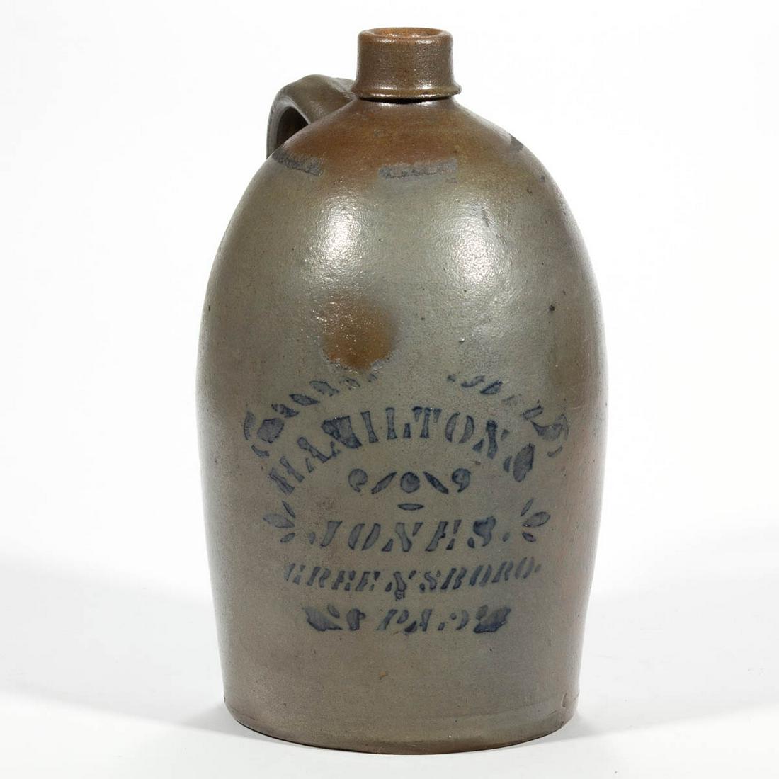 WESTERN PENNSYLVANIA STENCILED STONEWARE JUG: WESTERN PENNSYLVANIA STENCILED STONEWARE JUG, salt-glazed, approximately one-gallon capacity, semi-ovoid form, having plain mouth with lower ring collar, and strap handle with medial ridge. Stenciled 