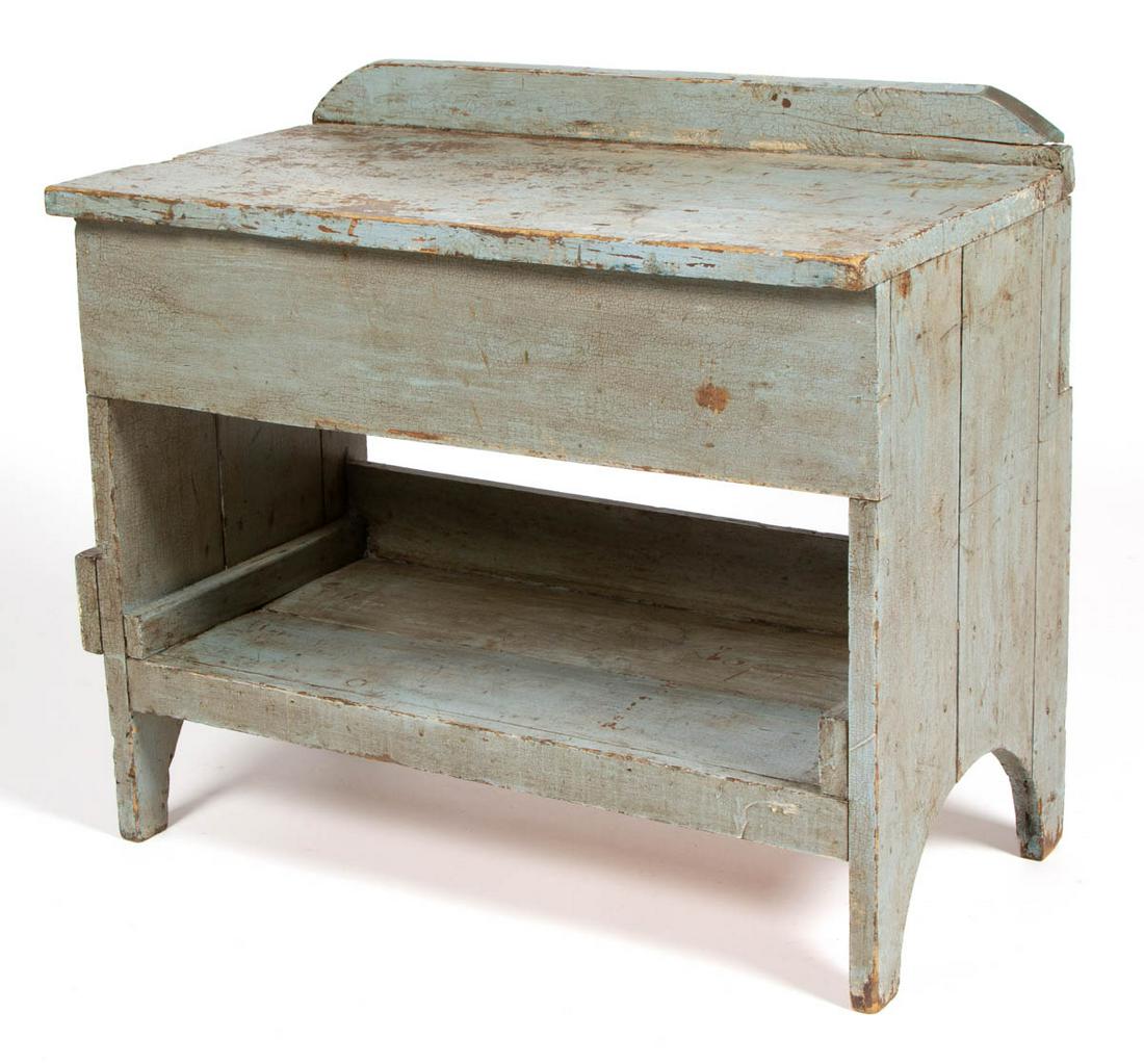 AMERICAN PAINTED PINE WORK BENCH: AMERICAN PAINTED PINE WORK BENCH, with applied gallery, lower medial shelf, sides with cut-outs. Old light blue-painted surface. Fourth quarter 19th century. 26 1/4" H, 30" W, 16 1/4" D.Good overall c