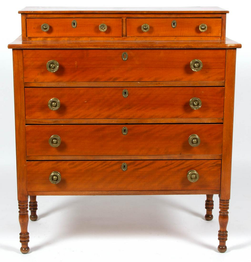 NEW ENGLAND LATE FEDERAL FIGURED BIRCH AND TIGER MAPLE: NEW ENGLAND LATE FEDERAL FIGURED BIRCH AND TIGER MAPLE CHEST OF DRAWERS, two-over-four drawers, solid ends, and tall legs turned from the stiles, likely original brass knobs and escutcheons. Pine seco