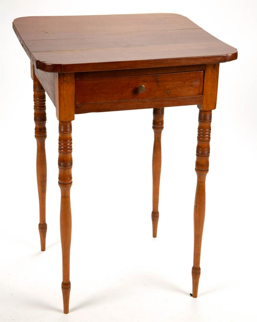 NEW ENGLAND LATE FEDERAL CHERRY STAND TABLE: NEW ENGLAND LATE FEDERAL CHERRY STAND TABLE, two-board top over a single full drawer raised on slender baluster-turned legs. Pine secondary wood. Old surface with warm color. Circa 1820. 28 1/4" H, 20