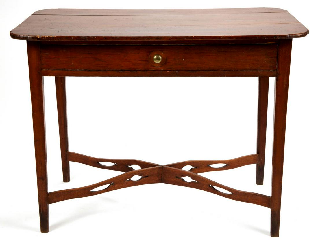 NEW ENGLAND COUNTRY PINE WORK TABLE: NEW ENGLAND COUNTRY PINE WORK TABLE, rectangular one-board cut-corner top over single full drawer raised on square-tapered legs joined with unusual pierced stretcher. Refinished surface. Circa 1810. 2