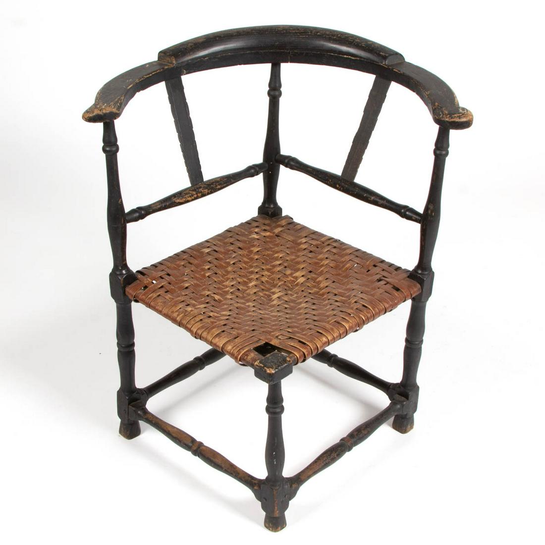 NEW ENGLAND COUNTRY QUEEN ANNE PAINTED CORNER CHAIR: NEW ENGLAND COUNTRY QUEEN ANNE PAINTED CORNER CHAIR, woven-splint seat, baluster turnings, and old black-painted surface. Second half 19th century. 28 1/2" H, 16" SQ seat. Fair overall condition with 