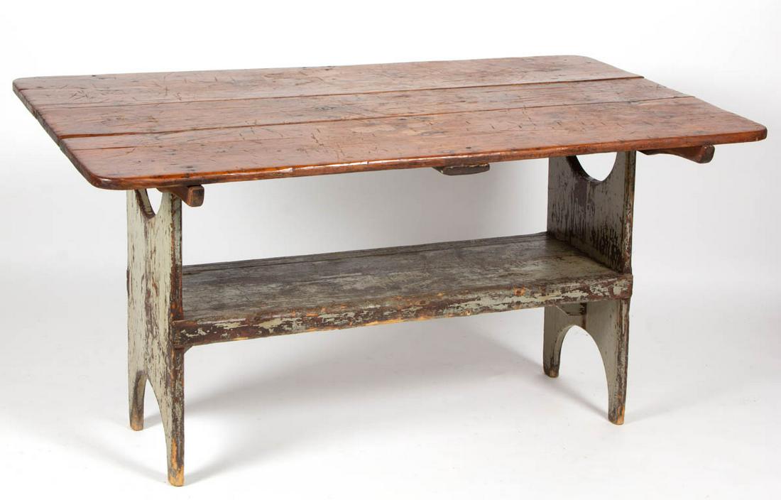 COUNTRY PAINTED PINE HUTCH TABLE: COUNTRY PAINTED PINE HUTCH TABLE, rectangular top, the base raised on cut-out ends. Retains an old gray-painted surface. 19th century. 55" W, 31 1/2" D. Good overall condition, possibly later battens,