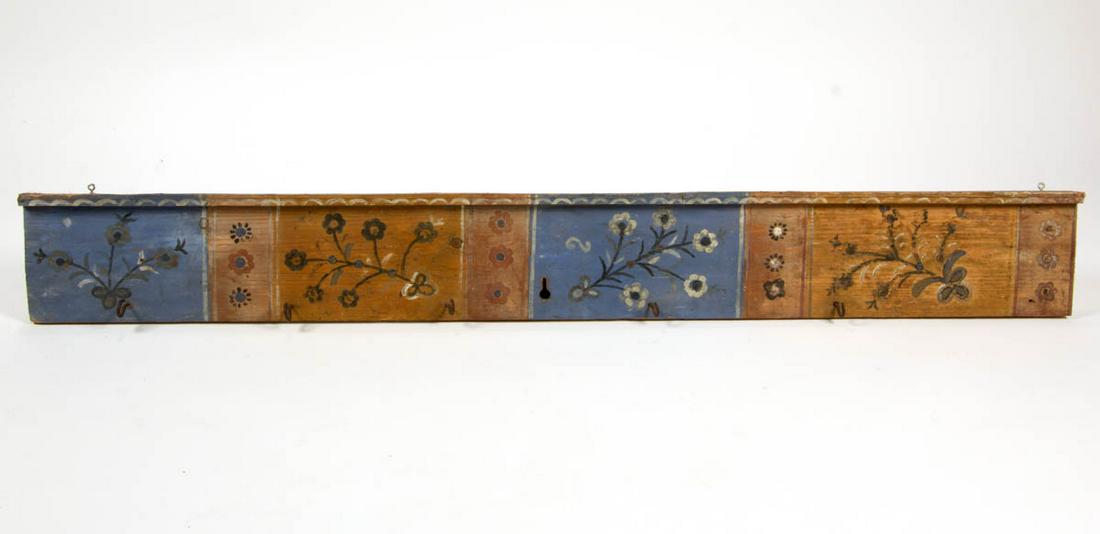 CONTINENTAL PAINT-DECORATED PINE PEG RAIL: CONTINENTAL PAINT-DECORATED PINE PEG RAIL, with five cast-iron hooks, the whole with floral designs. Retains likely original polychrome-painted surface. Late 19th/first half 20th century. 8" H, 66" L.